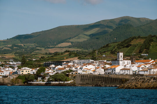 Coastal Town and Mountain Backdrop