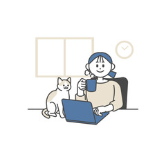 自宅でパソコンを開き猫の隣で仕事をする女性