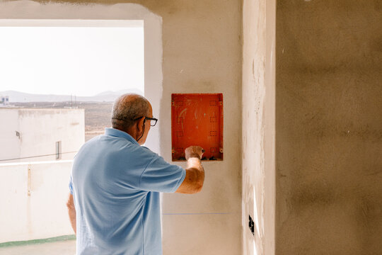 Property owner checking the progress of renovations to his home