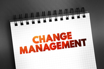 Change Management text quote on notepad, concept background
