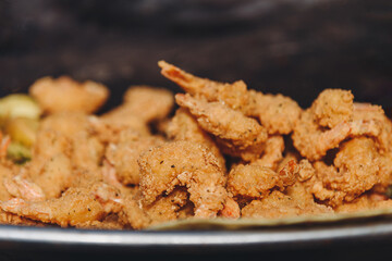 fried Shrimps frying in large pan outdoors, street food concept