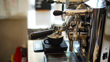 Barista make a coffee with coffee machine