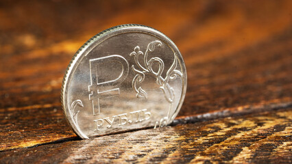one Russian ruble on a wooden table