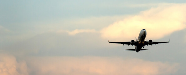 A plane in the sky during take -off or landing