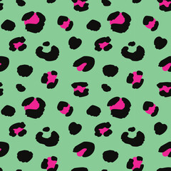 Leopard print pattern with black and pink spots on a green background, creating a bold and exotic design