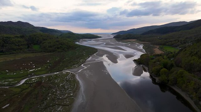 Afon Mawddach Estuary Tidal Channels and Mudflats in Snowdonia National Park Wales during sunset