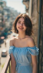 Fototapeta premium Young Woman Smiling In A Light Blue Dress on a Balcony Overlooking a City.