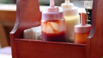 Adding Sauce to a Condiment Caddy
