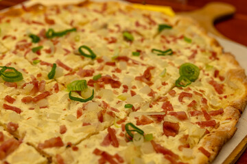 Delicious freshly baked pizza topped with savory ingredients ready to be enjoyed at a cozy eatery in the evening