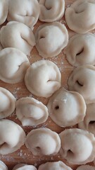 White flour dumplings lie uncooked 