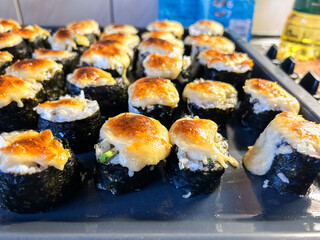 Real homemade sushi rolls with natural unfiltered look. Image for cooking and lifestyle blogs.