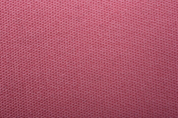 Pink denim jeans texture close up. Pink denim jeans background.