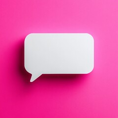 Fototapeta premium White speech bubble on vibrant pink background evokes modern communication