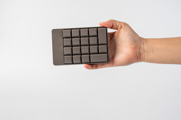 Bourne key contact numbers in hand on a white background.