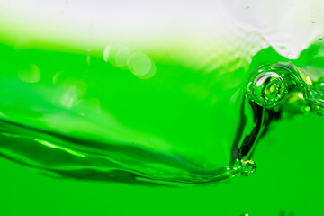 Water wave, close up of vibrant green liquid with bubbles, capturing dynamic movement and...