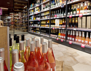 defocused alcohol (wine, champagne, liquor, whiskey) on store shelves