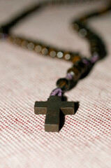 selective focus of a Rosary in the shape of a cross