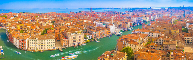 Fototapeta premium Panorama of stunning cityscape of Venice, Italy, featuring the iconic Grand Canal winding through the historic city, with elegant architecture and breathtaking palaces and bridges