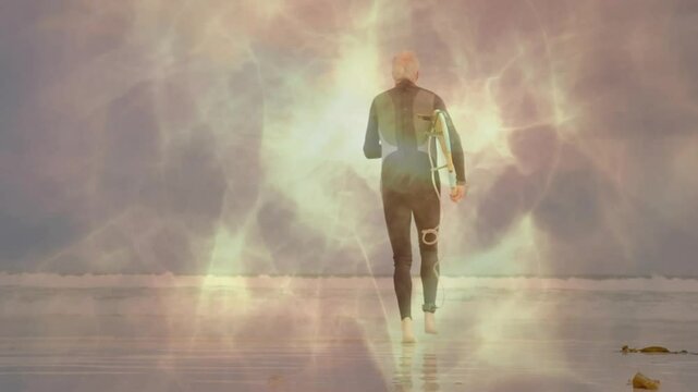 Senior surfer walking into water on beach with surfboard, featuring animated bokeh for health