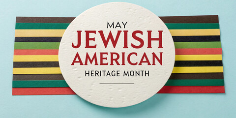 Sign on colored stripe background, commemorating May Jewish American Heritage Month