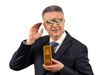 A middle-aged man in a business suit wearing glasses with a US dollar symbol holds a 999 fine gold...