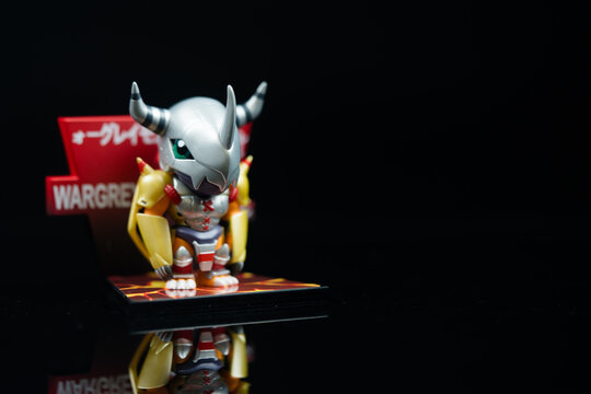 Bangkok, Thailand - May 2, 2025 : WarGreymon figure toy from the Digimon Adventure Fridge Magnet Series Figures.