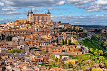 Naklejka premium View of Toledo, Castila la Mancha, Spain, world heritage city with the Alcazar high above on a bright day