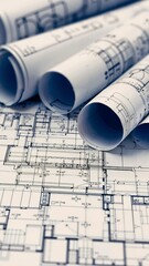 A bunch of blueprints sitting on top of a table