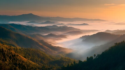 A scenic view of layered mountain ranges covered in fog during a warm sunrise or sunset light