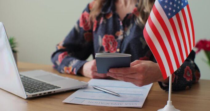 American woman consular officer giving passport to male immigrant, work visa, citizenship. Visa Application online form immigration concept. Visa approval.