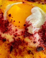 "An opulent seafood tower featuring Alaskan king crab, Iranian caviar, and Maine lobster, garnished with gold leaf and edible flowers."

