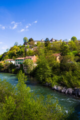 Obraz premium Town of Saint-Lizier, dominated by its episcopal palace, from the banks of the Salat River