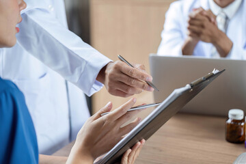 Doctor reviewing medication instructions with a patient in detail