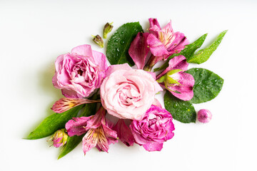 Romantic pink floral arrangement with rose petals and alstroemeria, nature-inspired flat lay on white