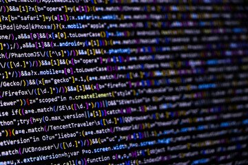 Software source code. Programming code. Programming code on computer screen. Developer working on...
