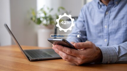 Close-up view of a person using a phone with a progress bar.