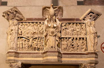 PISTOIA, ITALY - MARCH 16, 2025: The marble reliefs of with the easter scenes on the medieval pulpit in the church Chiesa di San Giovanni Fuorcivitas by Guglielmo da Pisa (1270)