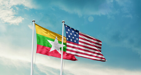 Myanmar (Burma) and America friendship flags are waving in the sky.Two country flag for agreement...