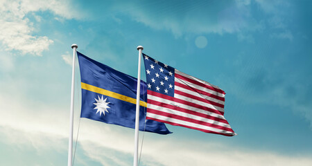 Nauru and America friendship flags are waving in the sky.Two country flag for agreement or deal. Nauru USA national flag for comittment.