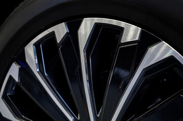Car wheel with brake calipers and stylish design.