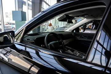 Car interior - steering wheel, shift lever and dashboard. Car modern inside.