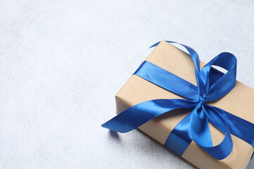 gift box with blue ribbon