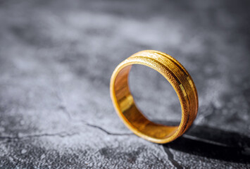 gold ring, gold price, gold jewelry, close up of gold ring on grey background