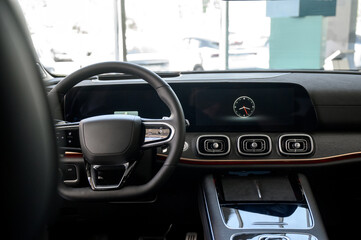 Car interior - steering wheel, shift lever and dashboard. Car modern inside.
