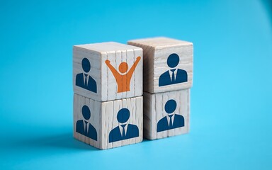 Wooden Blocks Illustrating Human Resources Concept With One Standout Individual And Business Professionals On A Blue Background