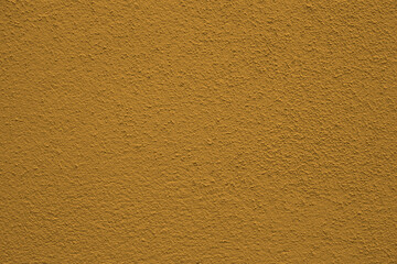 Background - grain texture yellow brown paint wall. Beautiful abstract grainy decorative navy light monochrome wallpaper backdrop. plaster stucco cement texture. Abstract with copy space for design