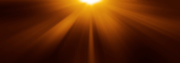 Obraz premium abstract photo of light burst among trees and glitter bokeh. image is blurred. yellow golden bokeh pattern background. Real optical lens flare on black backdrop. sunrays, sun rays beam, burst, sunbeam