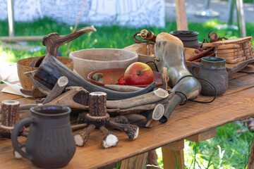 Rustic medieval feast table with antlers and drinking horns