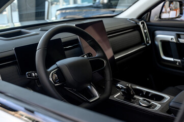 Car interior - steering wheel, shift lever and dashboard. Car modern inside.
