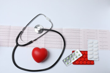 stethoscope, large pile of multi-colored pills in blister pack disposable , close-up